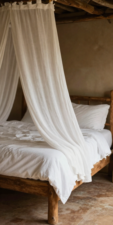Canopy bed dressed in white linen